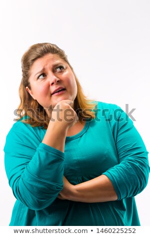 Foto stock: Fatty Woman With Her Hand On Chin Thinking