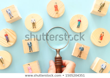 Foto stock: Magnifier Over Figures