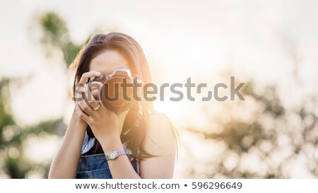 Stockfoto: Asian Female Photographer With Digital Camera