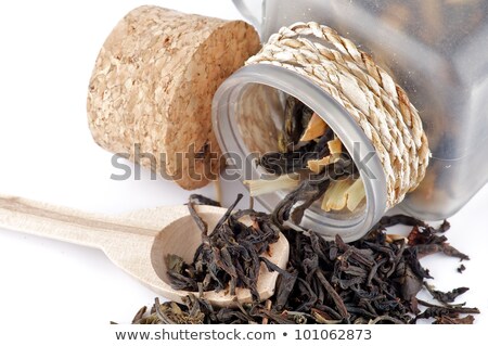 Stockfoto: Tea Leaves In Transparent Parisons With Wooden Spoon