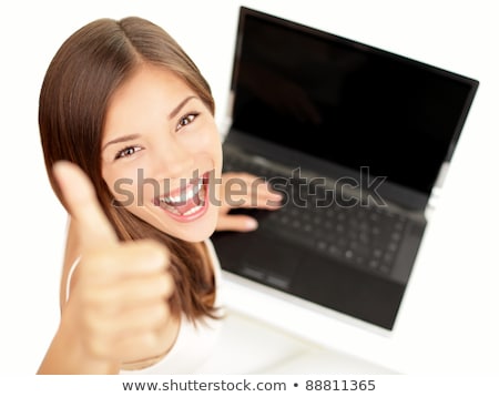 A Businesswoman With A Laptop Giving The Thumb Up Stockfoto © Ariwasabi
