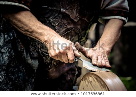 Foto stock: Knife Sharpening On Wet Grinder