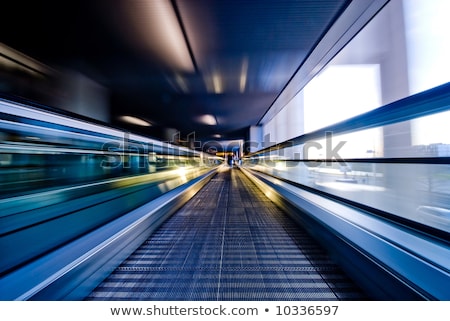 Stok fotoğraf: Blurred Abstract Background Of People On Oving Escalators