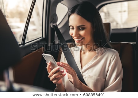 Stockfoto: Girl On Phone By Car