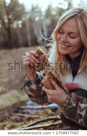 Foto stock: Woman Holding Loaf Of Bread