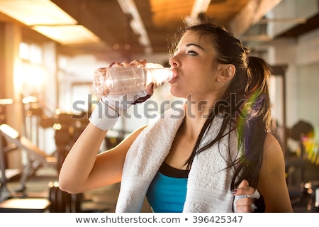 Foto stock: Fitness Strong Woman Resting For Drinking Water