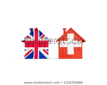 ストックフォト: Two Houses With Flags Of United Kingdom And Switzerland