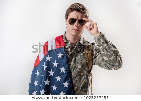 Stock photo: Frown Man Adjusting His Eyeglasses