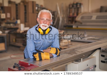 Foto stock: Senior Grey Haired Man Standing Deep In Thought