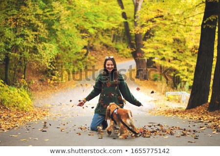 Stockfoto: Attractive Young Blonde Posing With Two Dogs