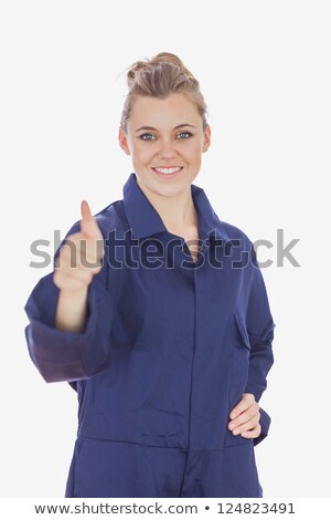 Zdjęcia stock: Female Technician Witth Hand On Waist Showing Thumbs Up Sign