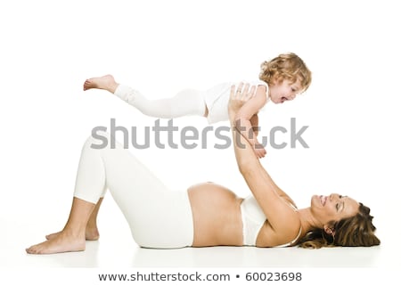 Foto stock: Beautiful Pregnant Woman With Her Daughter Isolated On White Ba