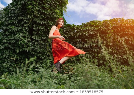 Stock fotó: Composite Image Of Stylish Brunette In Red Dress