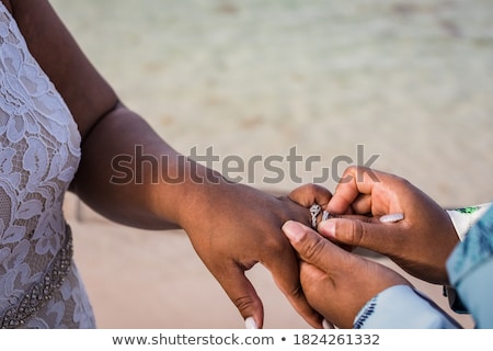 Foto stock: Close Up Of Lesbian Couple Hands And Wedding Rings