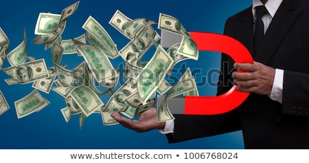 Foto stock: Magnet With Dollar Banknotes