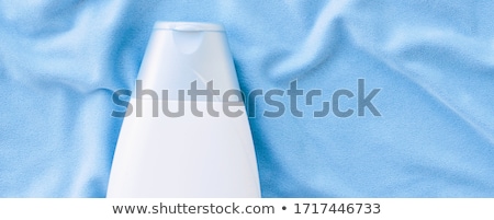 ストックフォト: Blank Label Shampoo Bottle Or Shower Gel Mockup On Blue Silk Background Beauty Product And Body Car