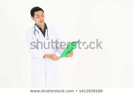 Stok fotoğraf: Young Man Looking At Paper With Disbelief