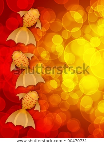 Stok fotoğraf: Three Fancy Goldfish On Red Blurred Background