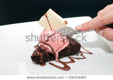 Stockfoto: Getting A Taste Of Brownie With Raspberry Icecream