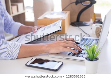 Stockfoto: Businessman Shop Owner Check Order Or List Inventory In Stock W