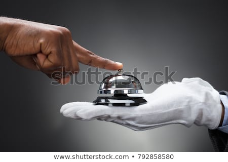 Foto d'archivio: Person Ringing Service Bell Held By Waiter