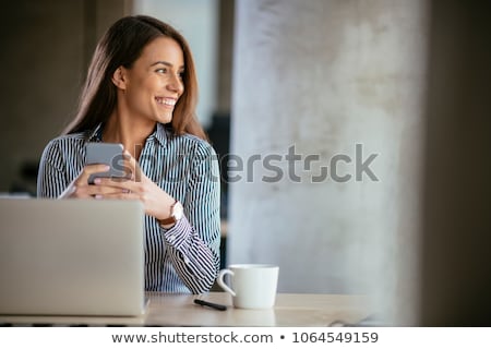 Stock photo: Businesswoman Calling On Smartphone At Office