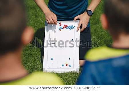 Sports Junior Team Coach Explaining Soccer Stratego For The Game Stockfoto © matimix