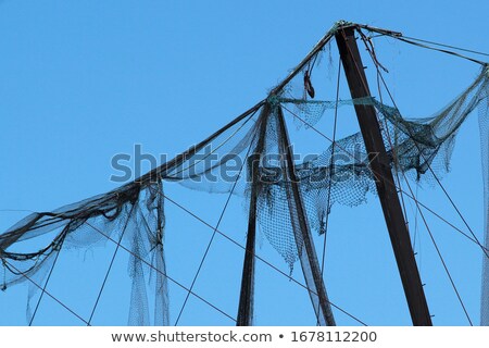 Сток-фото: Damaged Torn Blue Nylon Backdrop