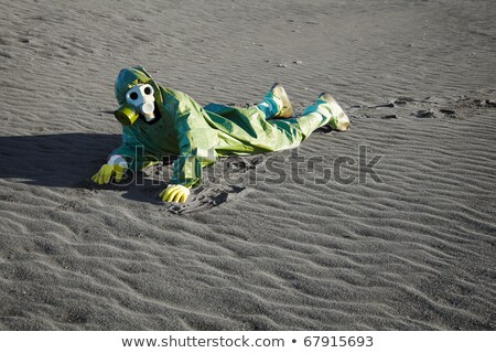 Man In Gas Masks Crawling On Poisoned Soil Stockfoto © pzAxe