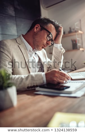 ストックフォト: Worried Businessman With Laptop And Document