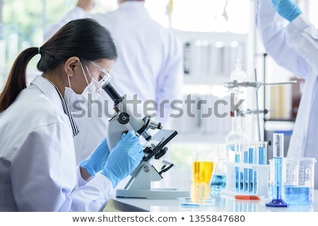 Foto stock: Senior Scientist Microscoping In Lab
