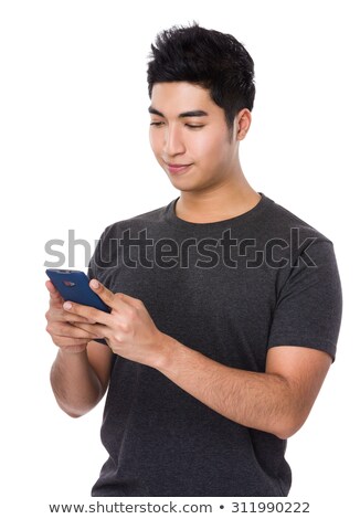 Stock photo: Mature Casual Indian Man Playing Smartphone Games
