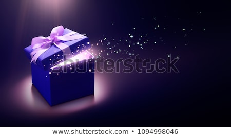 Foto stock: Purple Gift Box With Blue Ribbon Bow