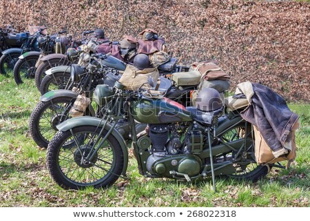 Foto stock: Green Military Motorcycles Parked In A Row