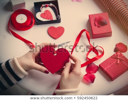 Foto stock: White Caucasian Hands Wrapping Heart Shaped Toy On The Wonderful