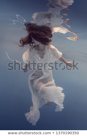 Foto d'archivio: Woman On Water In White Dress