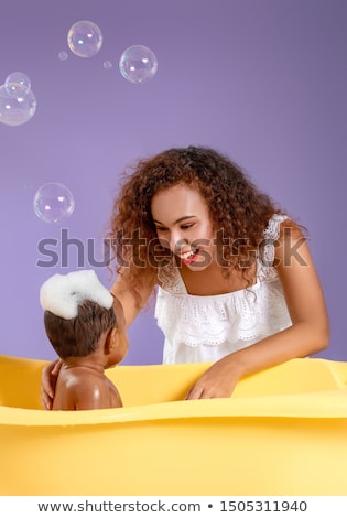 ストックフォト: A Mother Bathing Her Baby Boy