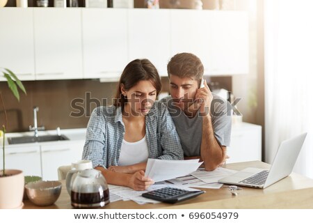 Stock foto: Coworkers Looking Over Paper Work
