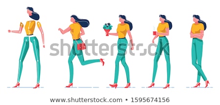 Foto stock: Beautiful Businesswoman Standing With Legs Crossed And Hand In P