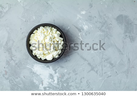 Stock photo: Homemade Cottage Cheese In A Black Ceramic Bowl