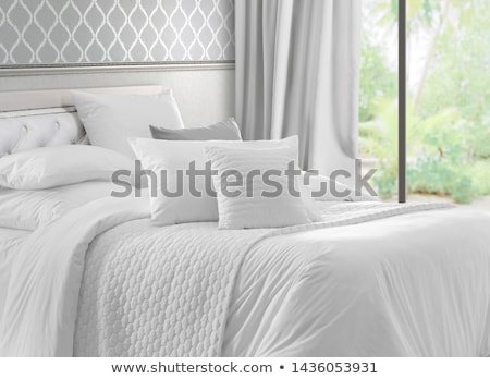 Stok fotoğraf: Comfortable Pillows On White Bed Decoration