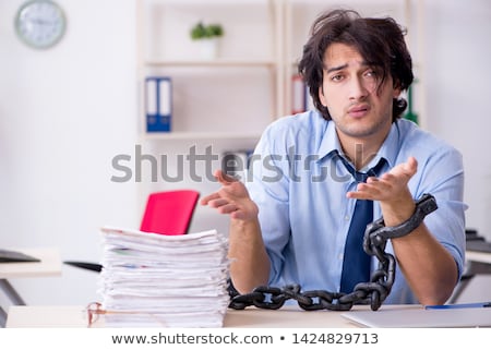 ストックフォト: Young Male Employee Unhappy With Excessive Work