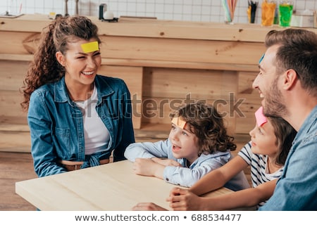 Stock photo: Happy Mother And Daughter Playing Guess Who Game