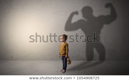 Stock photo: Cute Kid With Hero Shadow Behind