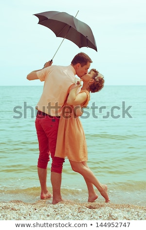 Beautiful Young Couple Standing At The Sunny Beach Сток-фото © Augustino