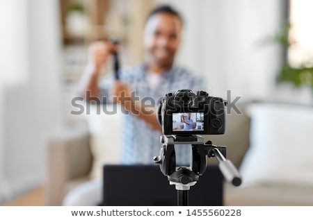 Stok fotoğraf: Male Video Blogger With Smart Watch Videoblogging