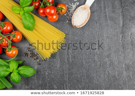 Foto stock: Close Up Of Cherry Tomatoes With Basil