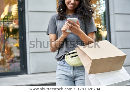 ストックフォト: Happy Young Woman Shopping In Boutique Store - Standing Near Gla