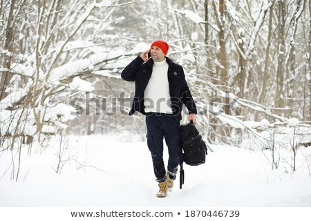 Zdjęcia stock: Man With Backpack Going To Winter Forest