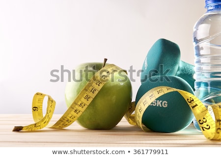 Foto stock: Fitness Concept Dumbbells Tape Measure And Water Bottle